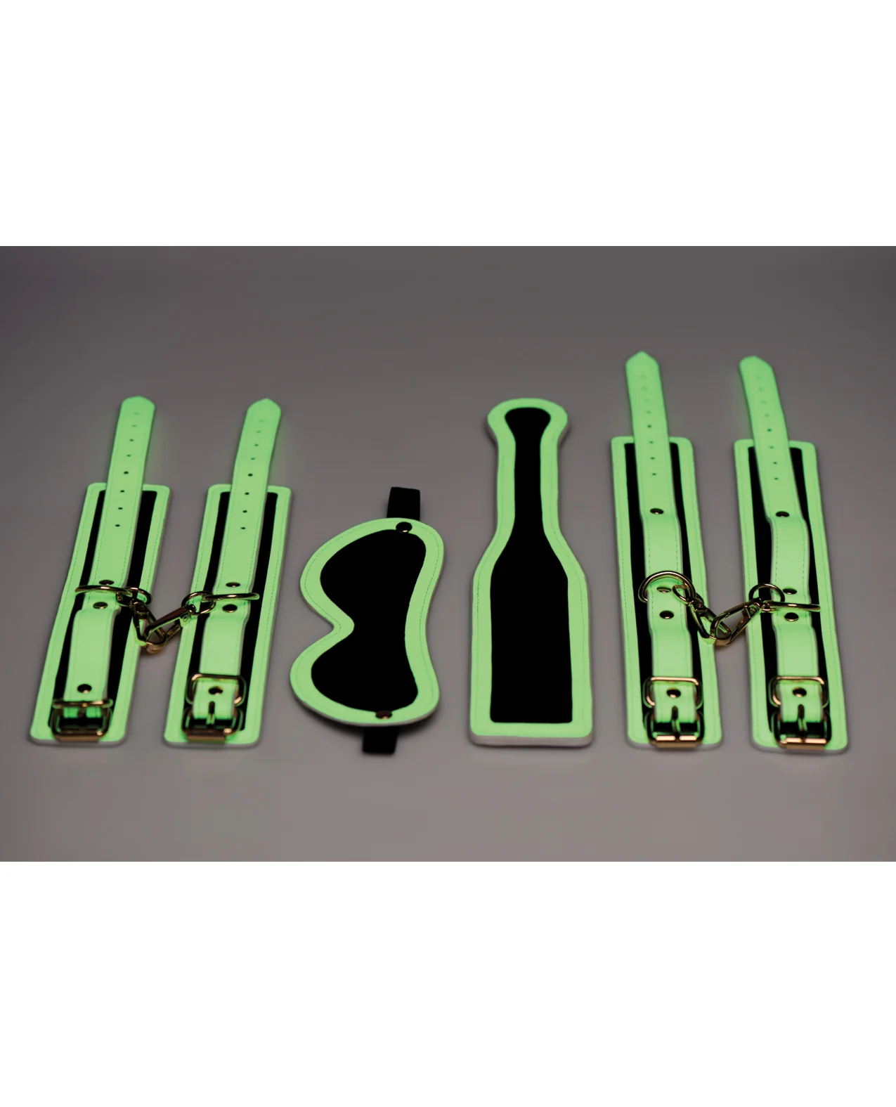 Master Series Kink in the Dark Glowing Cuffs & Blindfold & Paddle Set - Image 6